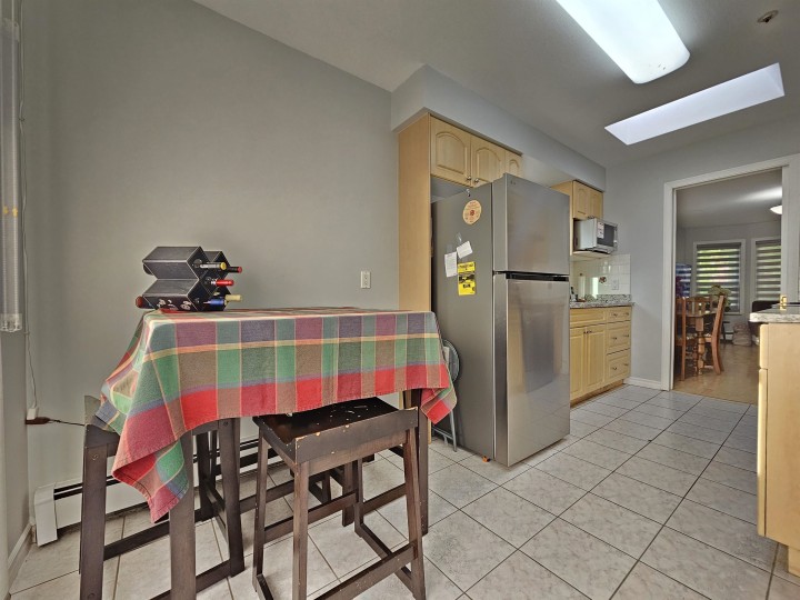 Photo 5 at 5521 Dundee Street, Collingwood VE, Vancouver East