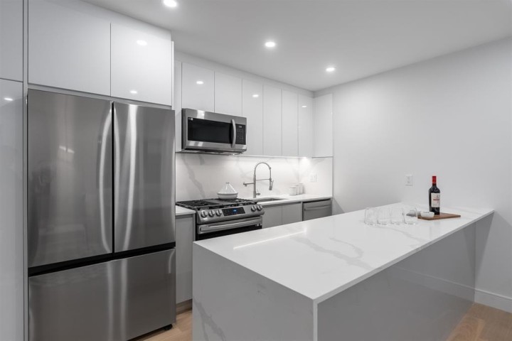 Photo 10 at 2881 E Georgia Street, Renfrew VE, Vancouver East